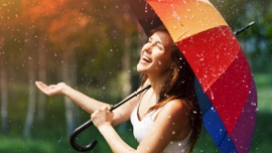 Happy-Girl-With-Rainbow-Umbrella-Under-Summer-Rain-1920x1080
